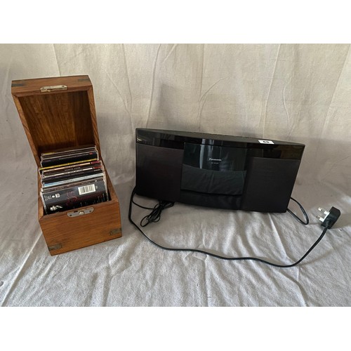 66 - A Panasonic stereo and a small selection of compact discs