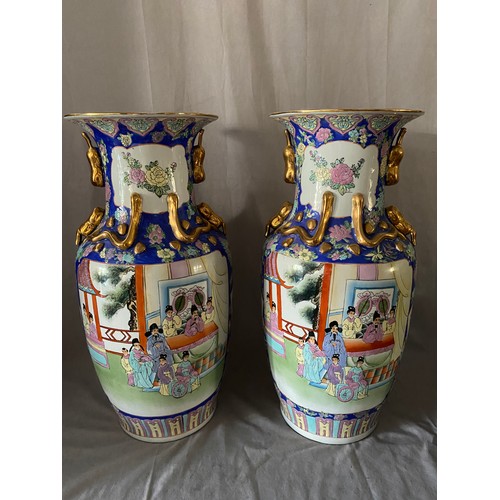 115 - A pair of modern Chinese vases, the panels depicting figures within blue floral necks with applied g... 