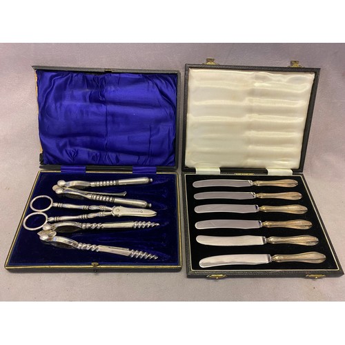 173 - A pair of silver plated nut crackers and grape scissors in fitted leather case and a set of six tea ... 