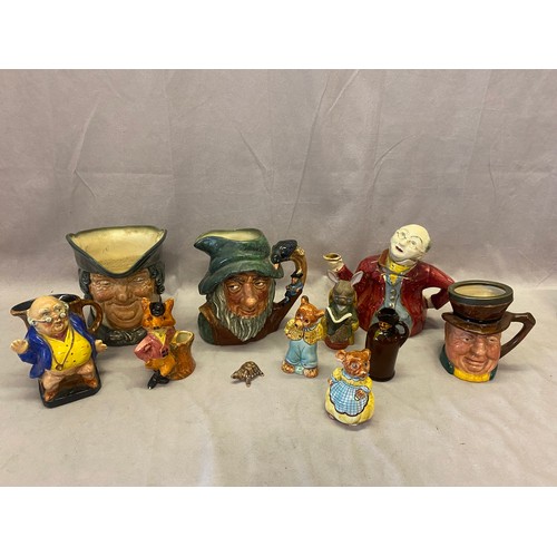 93 - Two Royal Doulton character jugs - Rip Van Winkle and Parson Brown, a teapot - Mr Pickwick Proposes ... 