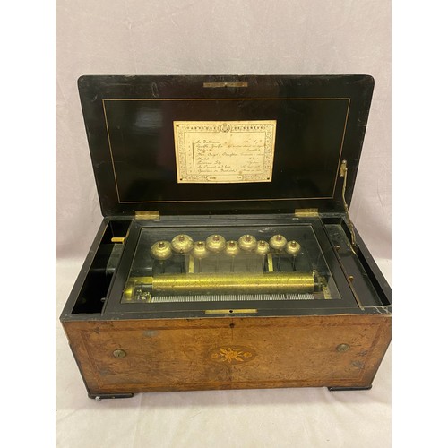 58 - A 19th Century French musical box playing eight airs striking on nine bells, in a walnut veneered an... 