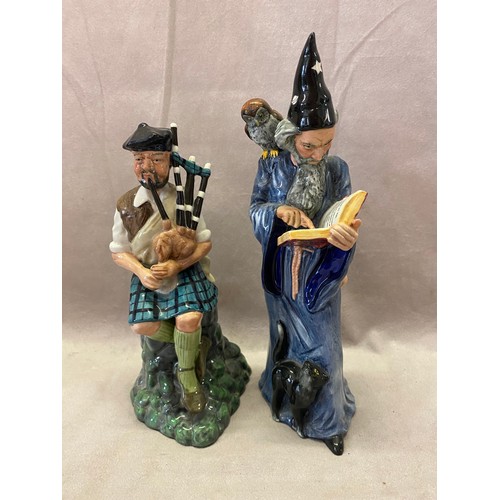 109 - Two Royal Doulton figures - The Piper HN2907 and The Wizard HN2877