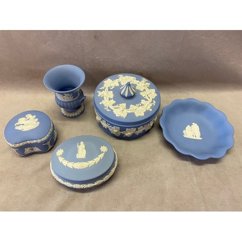 101 - Three Wedgwood blue jasper and white bas relief trinket boxes, a pin dish and a small urn