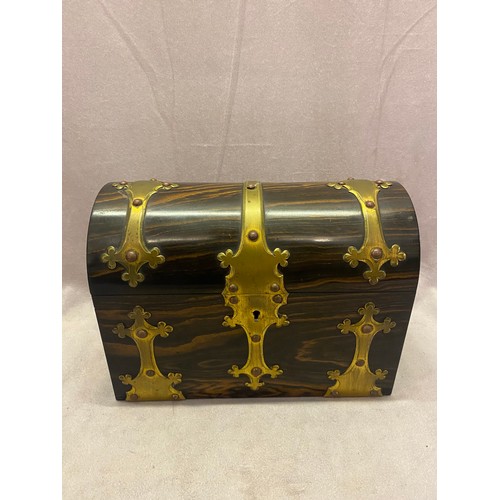 306 - A Victorian coromandel wood and brass bound tea caddy with dome shaped top, the interior fitted two ... 