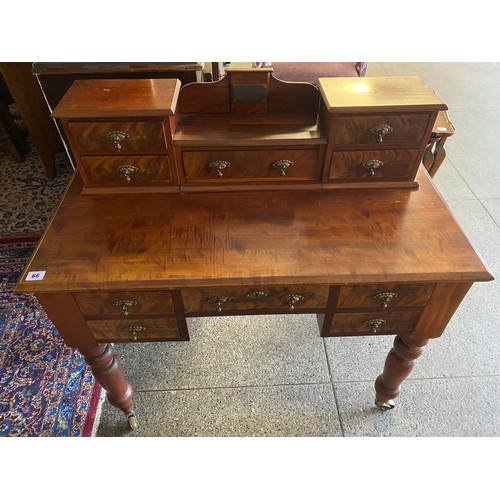 66 - A Victorian mahogany writing table, the raised back with presentation plaque above drawer flanked to... 