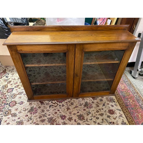 64 - A mahogany bookcase top fitted two glass panelled doors enclosing shelves - 47in. wide and an Edward... 