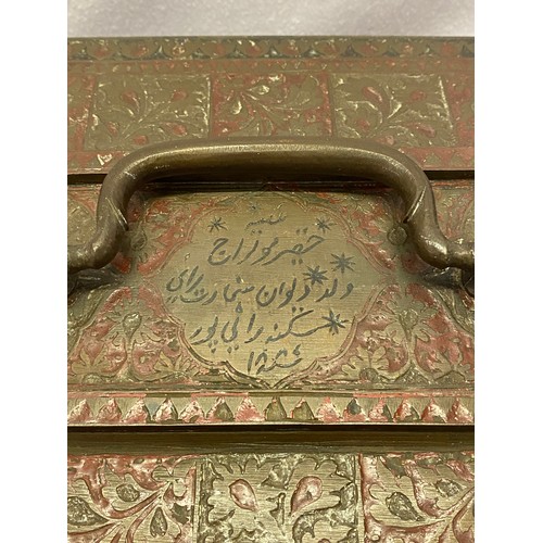 280 - An antique Indo Persian brass casket box with swing handle, chased with floral square panels, enamel... 