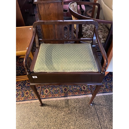 26 - An Edwardian mahogany piano stool with hinged seat on cabriole legs