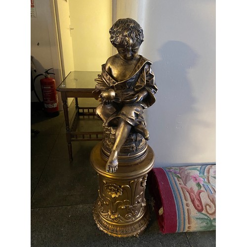 32 - A large gilded resin figure of a boy entitled Orfanello, complete with stand - 44in. high