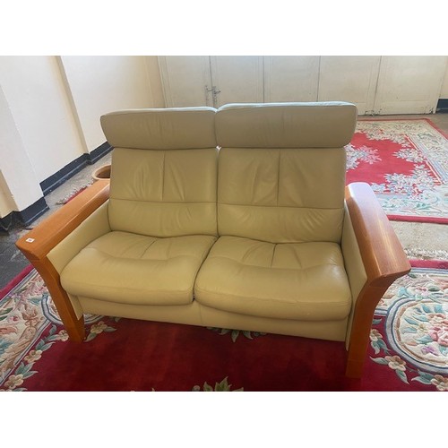 50 - An Ekorness Stressless cream leather two seater reclining settee