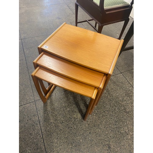 54 - A nest of three G Plan teak occasional tables