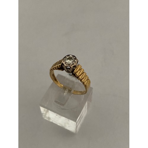 205 - A lady's ring set diamond, on an 18ct. gold shank