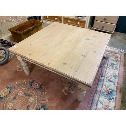 66 - A limed pine low coffee table, on turned legs - 33 1/2in. wide