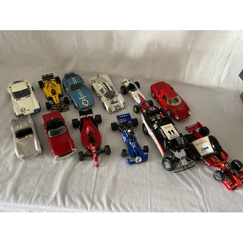 266 - A collection of scale model racing cars including Porsche 550a Spyder, Jordan Mugan Honda 198 1998, ... 