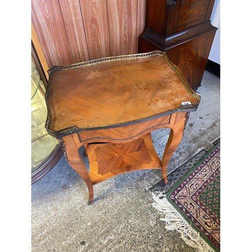 34 - A French style kingwood finished occasional table with 3/4 brass galleried top, on slender legs unit... 