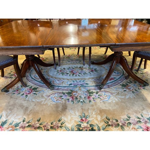 48 - A Georgian mahogany dining table with 'D' shaped ends, extra centre leaf, on turned baluster form co... 