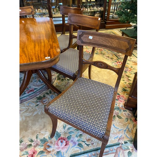 48 - A Georgian mahogany dining table with 'D' shaped ends, extra centre leaf, on turned baluster form co... 