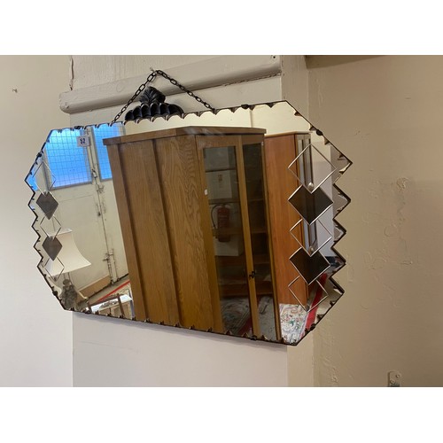 52 - A frameless wall mirror - 27in. wide, two other wall mirrors, a watercolour of fishing boats and two... 