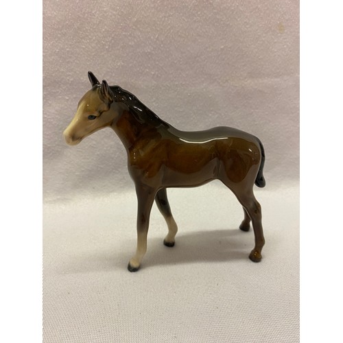 158 - Beswick models comprising:- black horse, brown horse, appalosso, stag, three foals and seated fox