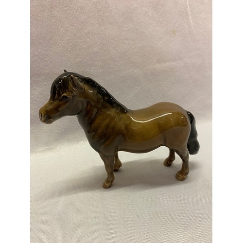 158 - Beswick models comprising:- black horse, brown horse, appalosso, stag, three foals and seated fox