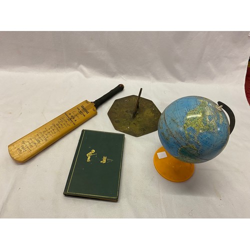 266 - A small octagonal brass sundial - 7in. wide, two small metal globes, a miniature cricket bat for the... 