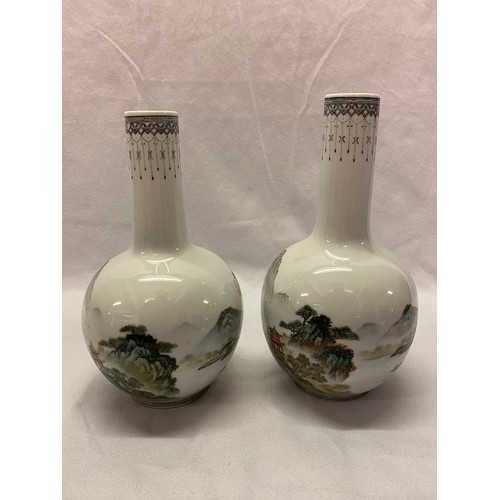 170 - A pair of Republic of China bottle shaped vases decorated poems, figures and pagoda in a landscape -... 