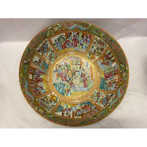 126 - A large 19th Century Cantonese bowl decorated all round with figures, flowers and insects in reserve... 