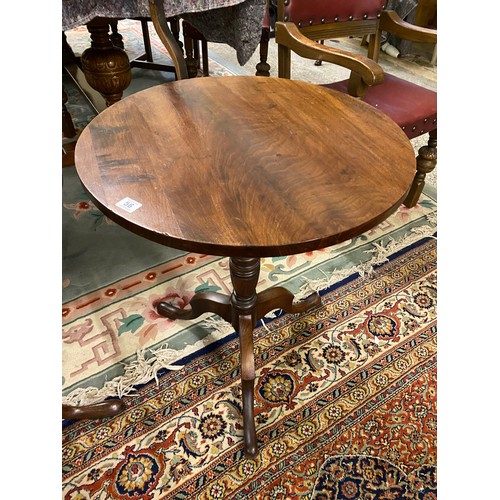 56 - A Georgian mahogany occasional table with circular top, ring turned column, on three dowswept legs -... 