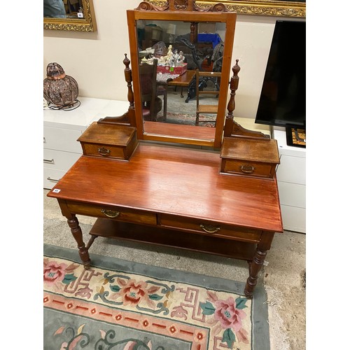 69 - An Edwardian mahogany dressing table fitted swing mirror and two jewel drawers, the base fitted two ... 