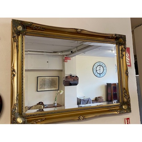 85 - A rectangular bevelled wall mirror in a gilt frame - 41in. x 29in. and an oval wall mirror in a gilt... 