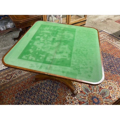 61 - A 19th Century mahogany card table with 'D' shaped folding top, tapering panelled column, on quatref... 