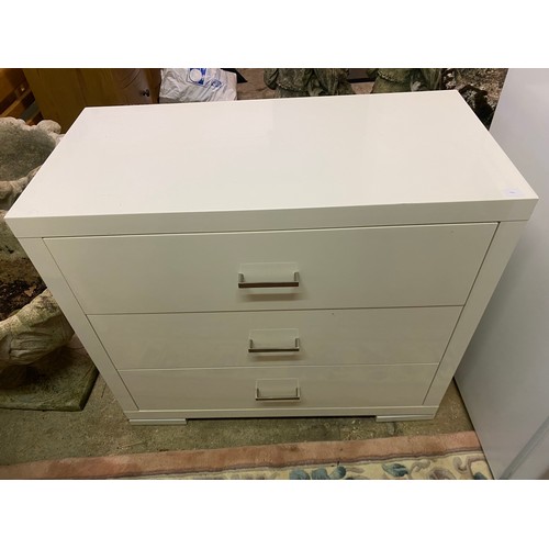 96 - A pair of modern white lacquered chests, each fitted three wide drawers - 31in. wide and a matching ... 