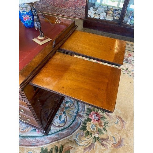 116 - A large Victorian mahogany pedestal desk with three quarter galleried top inset red leather writing ... 