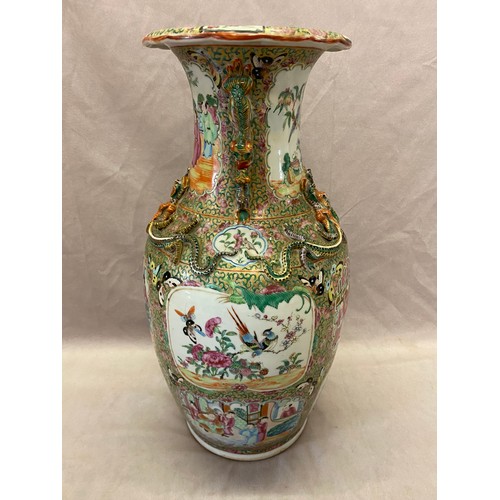 122 - A 19th Century Cantonese vase decorated with figures and insects, lizards to the neck - 17in. high