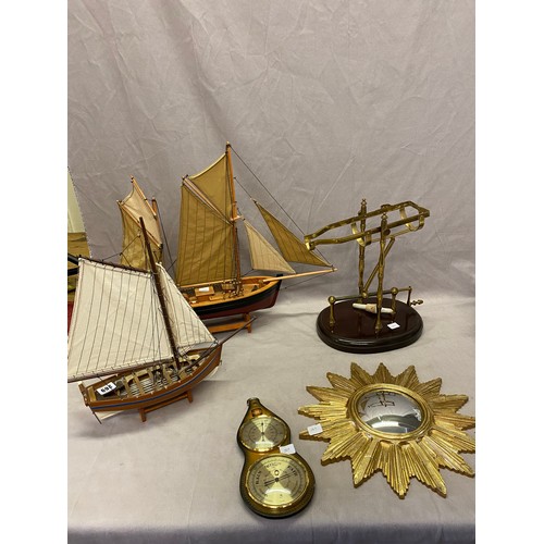 269 - Two modern wooden models of boats, a large wooden spoon and fork with carved mask decoration to the ... 