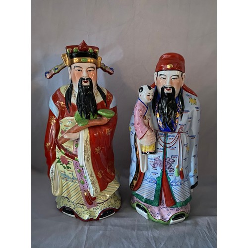 146 - Two large modern Chinese figures of an emperor and an emperor with a child - each 20in. high