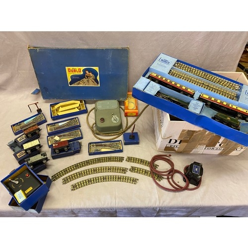 244 - Three Hornby Dublo Electric train sets, boxed together with a selection of track, footbridge etc..