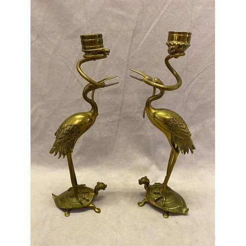 256 - A pair of Japanese brass candlesticks in the form of storks standing on the backs of turtles - 11 1/... 