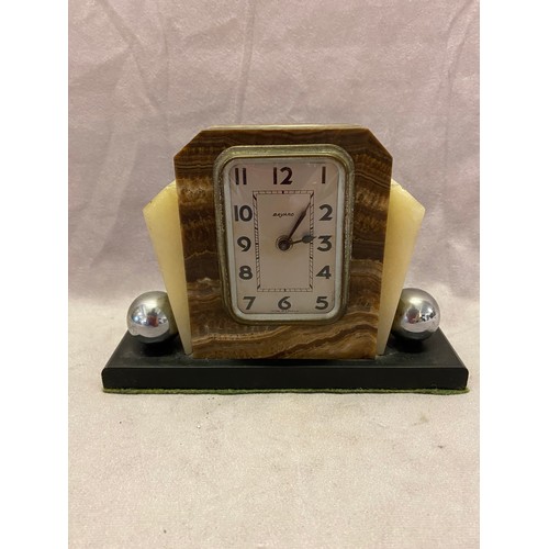 263 - An Art Deco Bayard mantel clock with rectangular silvered dial, in a variegated marble case with chr... 