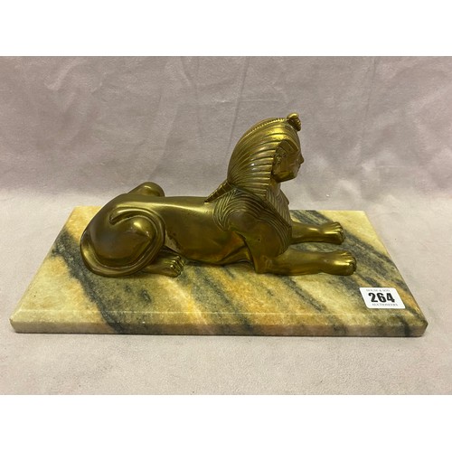 264 - A French Art Deco bronzed model of a sphinx on a variegated marble base - 13in. wide