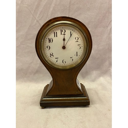 266 - An Edwardian mantel clock with cream enamel dial, in a mahogany and satinwood inlaid balloon shaped ... 