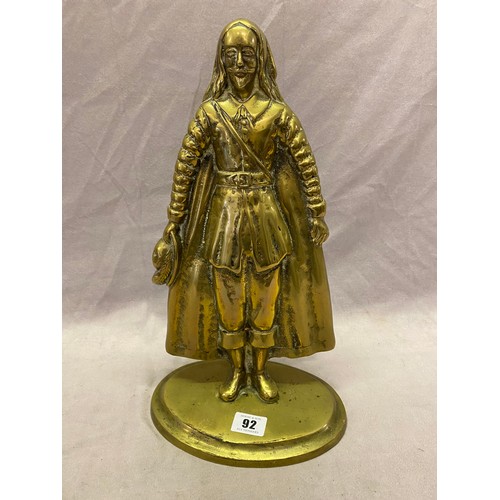 92 - A brass doorstop in the form of a Cromwellian figure - 16in. high