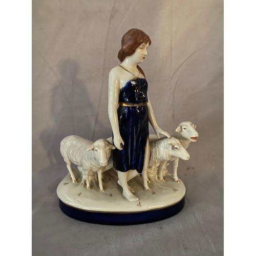 124 - A Royal Dux group of a girl and three sheep - 10in. high