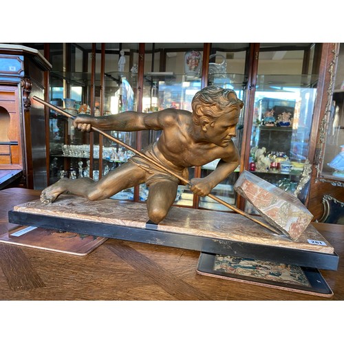 261 - A French Art Deco bronzed study of a classical male figure lifting a rock, on a marble base - 29 1/2... 