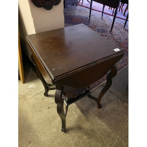 83 - An Edwardian mahogany occasional table fitted four shaped drop flaps, on slender cabriole legs unite... 