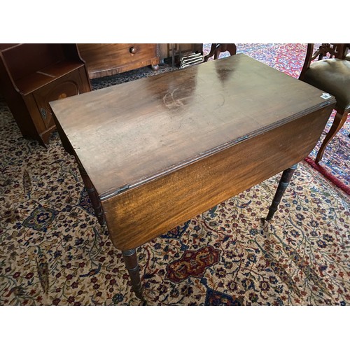 38 - A Georgian mahogany Pembroke table fitted two drop flaps, end drawer, on turned legs and brass casto... 