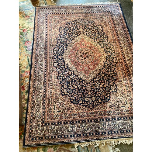 2 - An Eastern style rug, blue field with repeating floral pattern, multi bordered, fringed - 96in. x 67... 