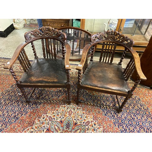 37 - A pair of Victorian carved oak hall chairs with coronets and leaf scrolls to the cresting rails, sha... 