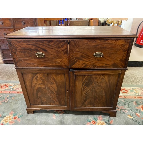 49 - A 19th Century mahogany secretaire chest with fitted interior above two panelled doors - 47in. wide