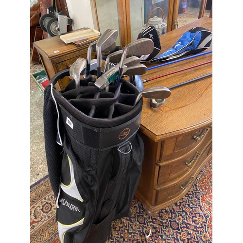 114 - A Motocaddy golf bag and golf clubs